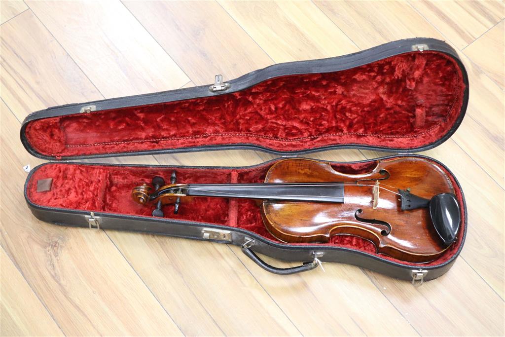 A 19th century Flemish? violin, length of back 35cm, cased with two bows
